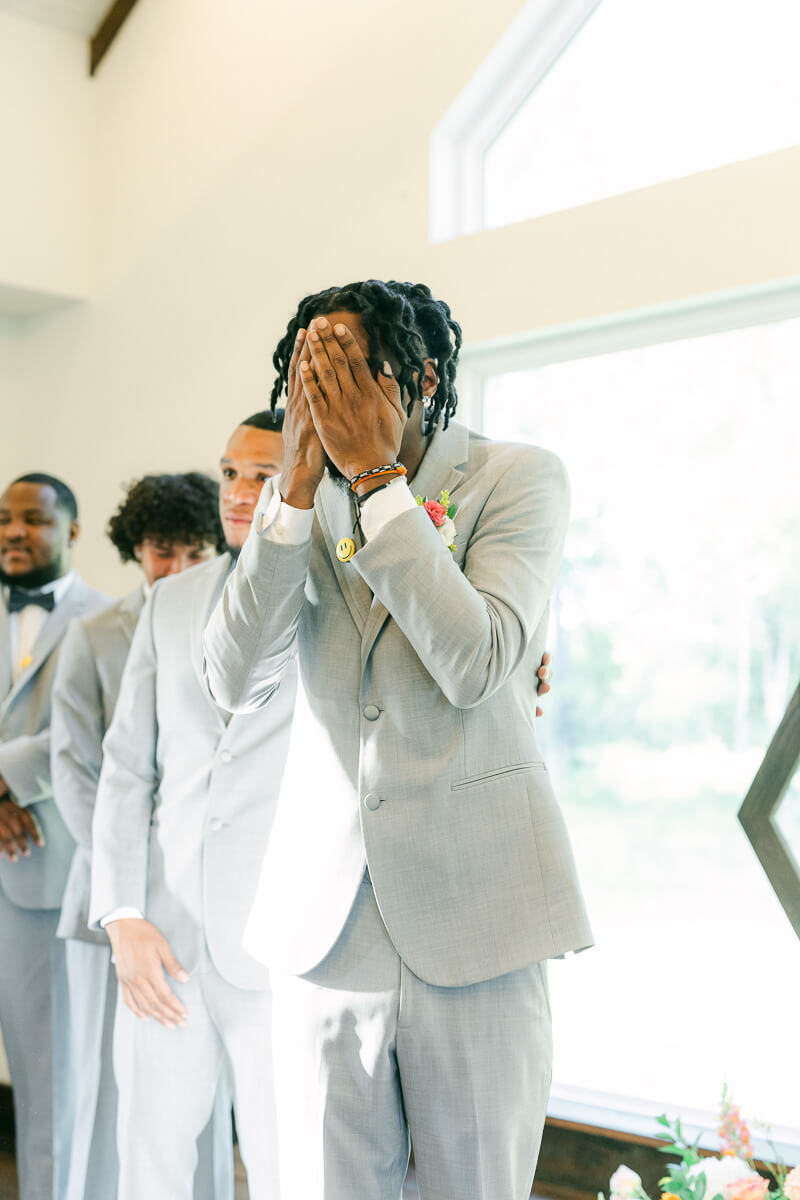 groom seeing his bride walk up the aisle at magnolia meadows 