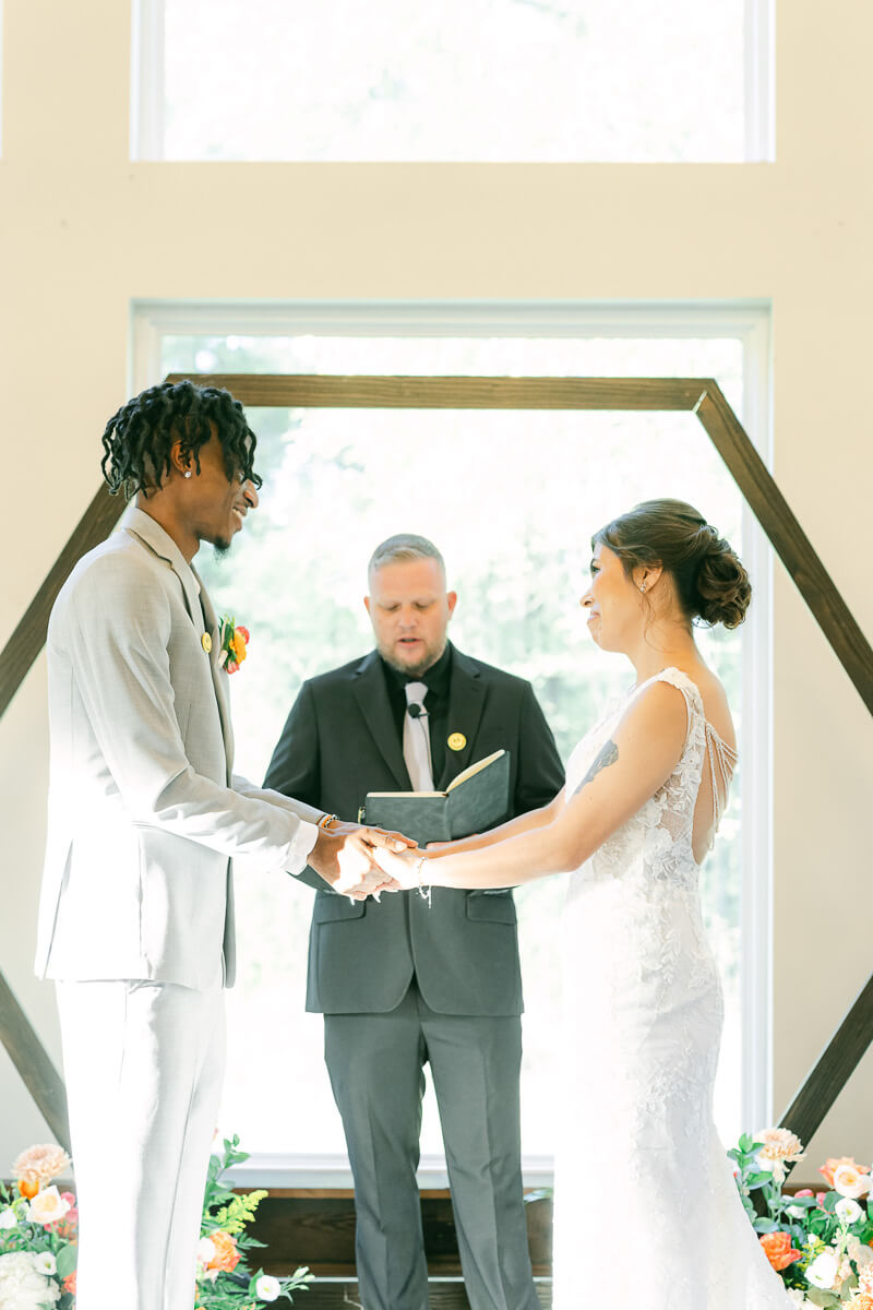 couple at the alter during their ceremony at magnolia meadows 