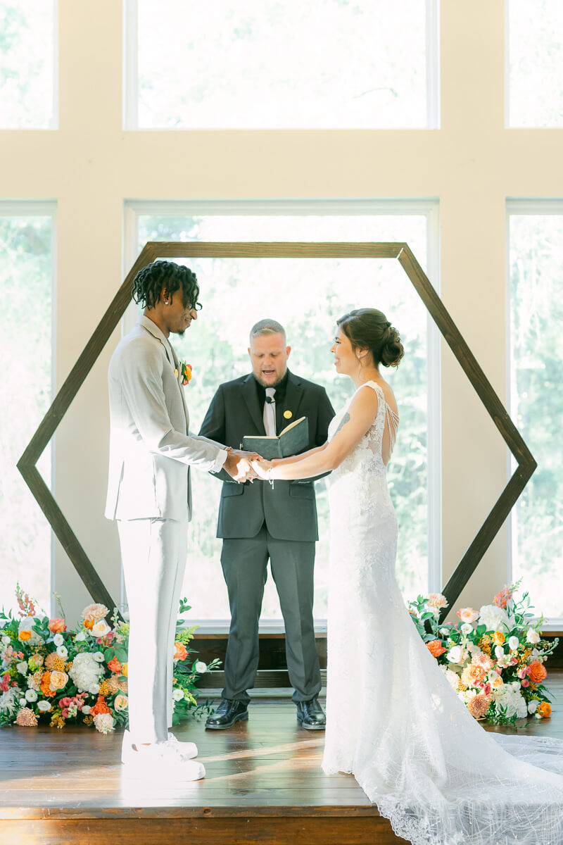 couple at the alter during their ceremony at magnolia meadows 