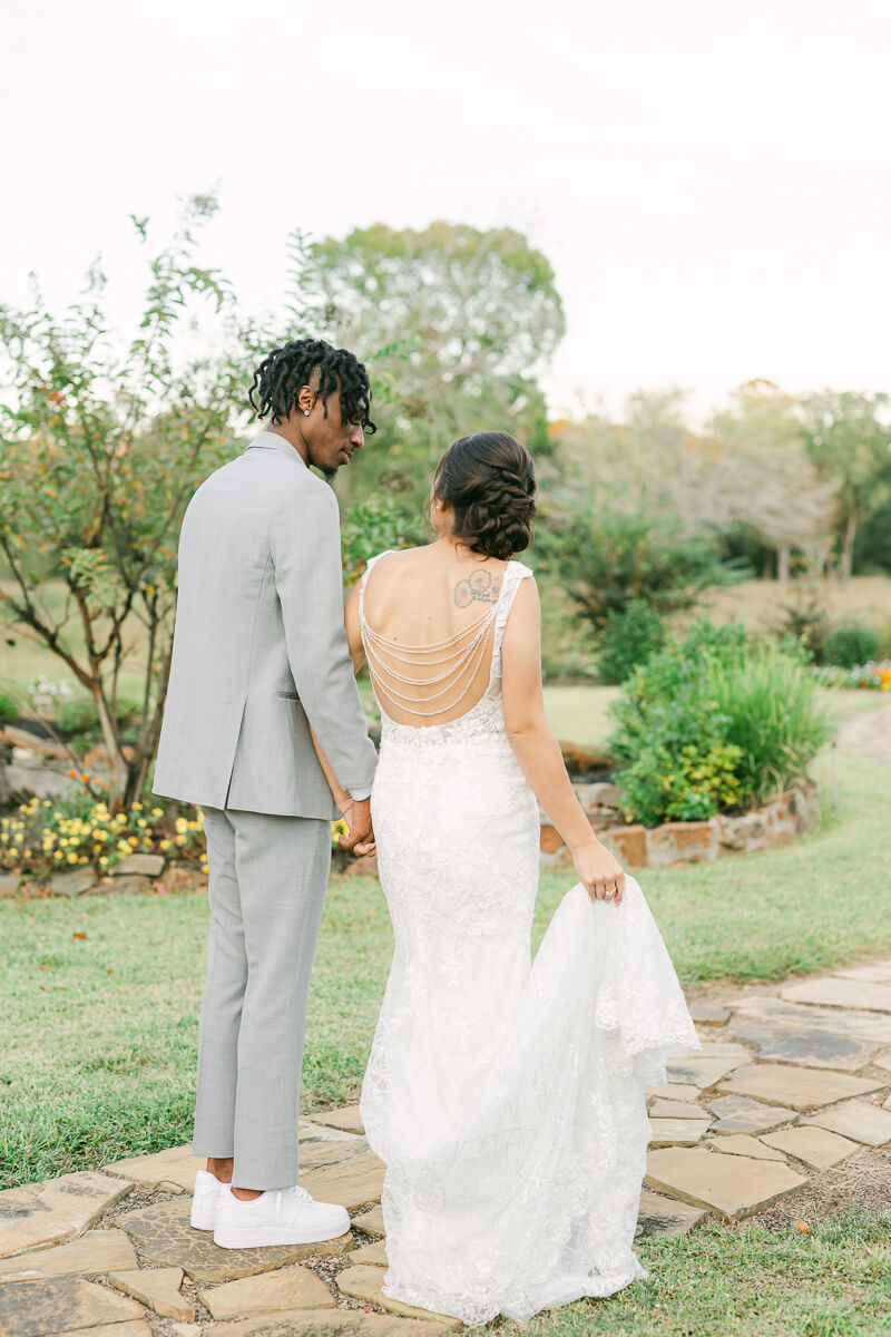 couple walking outside of magnolia meadows wedding venue