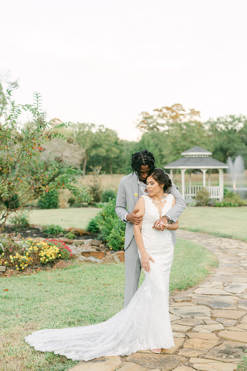 couple cuddling on wedding day