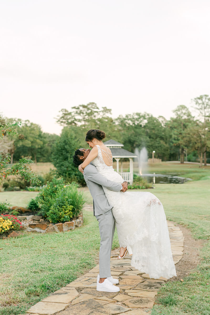 couple spinning at their magnolia meadows wedding