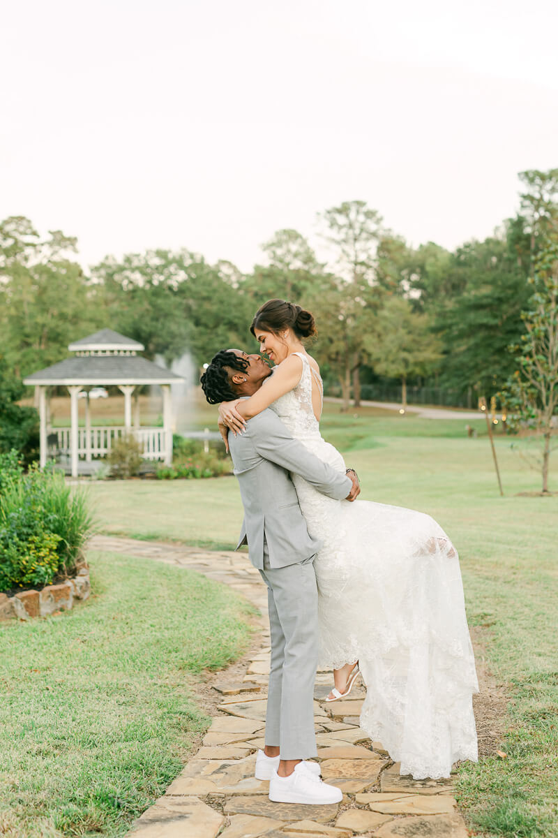 groom spinning bride at their magnolia meadows wedding