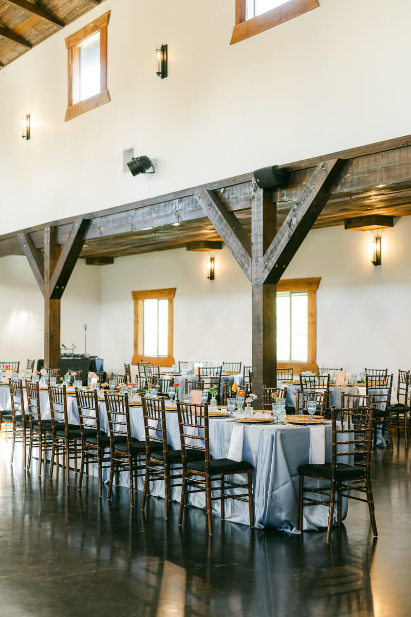 reception table inside magnolia meadows wedding barn