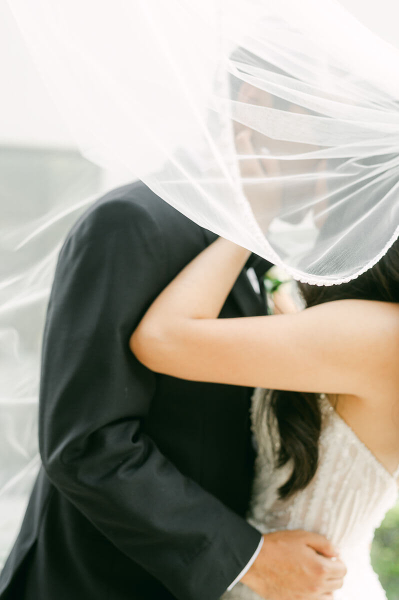 couple in front of The Peach Orchard wedding venue in Houston 