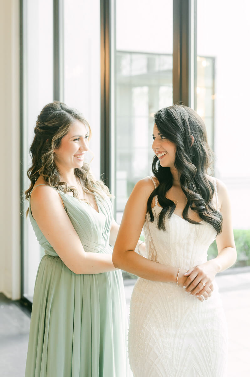 bride getting ready by Houston wedding photographer Eric & Jenn Photography