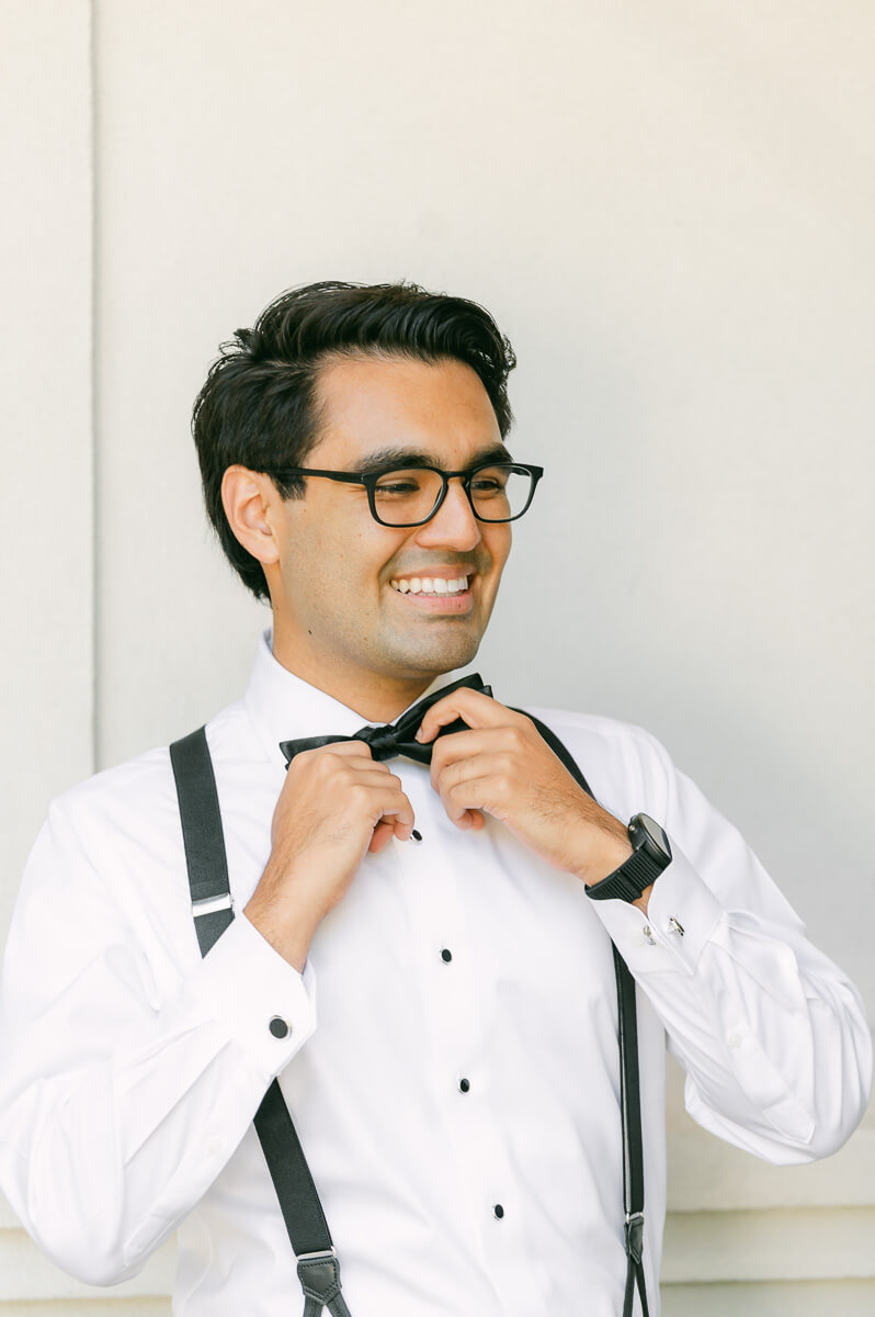 a groom getting ready by Houston wedding photographer Eric & Jenn Photography 