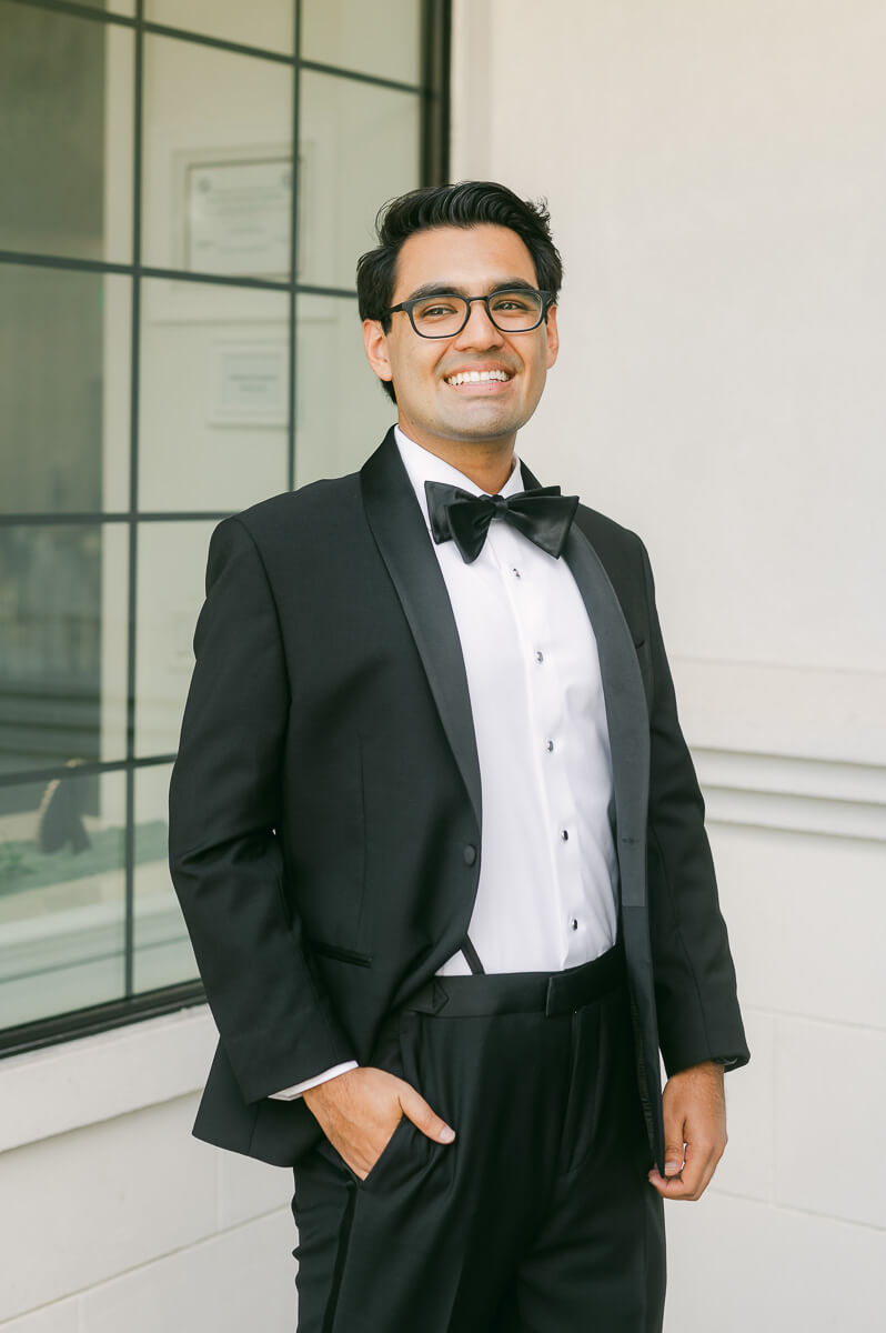 groom wearing black tux by Houston wedding photographer 