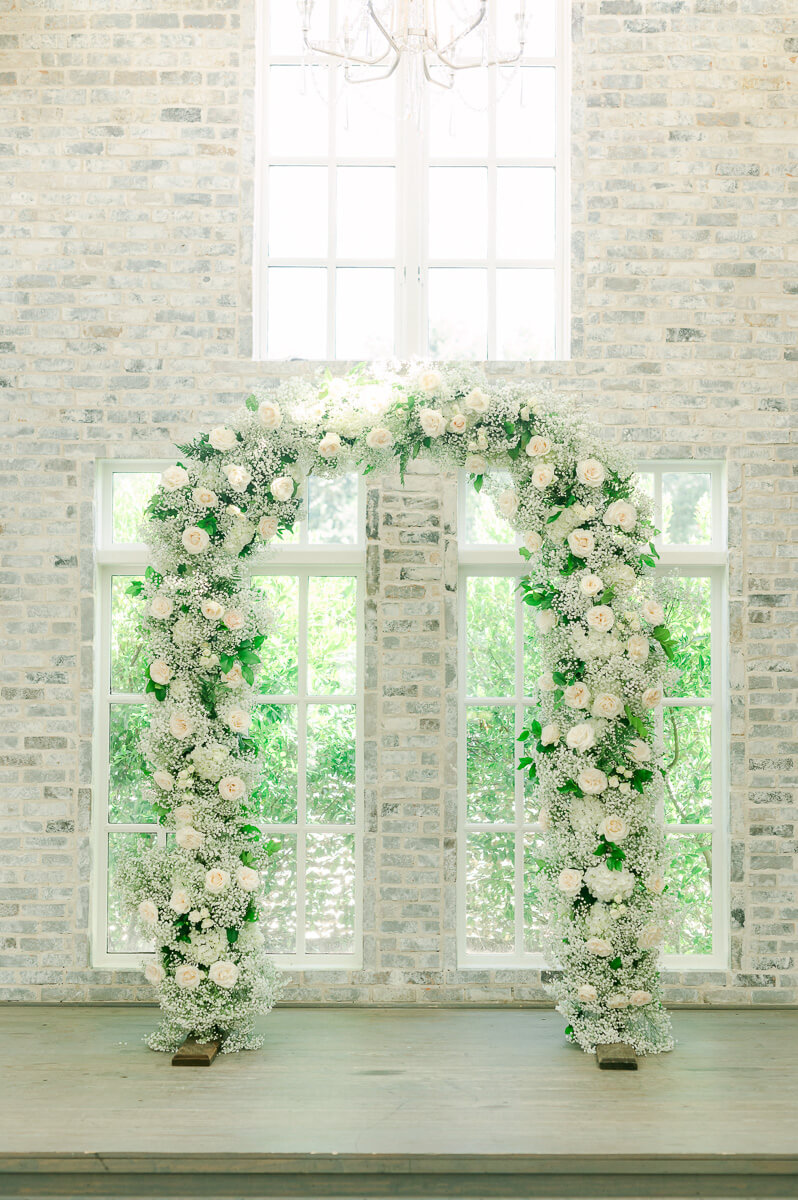 flower arch inside The Peach Orchard wedding chapel