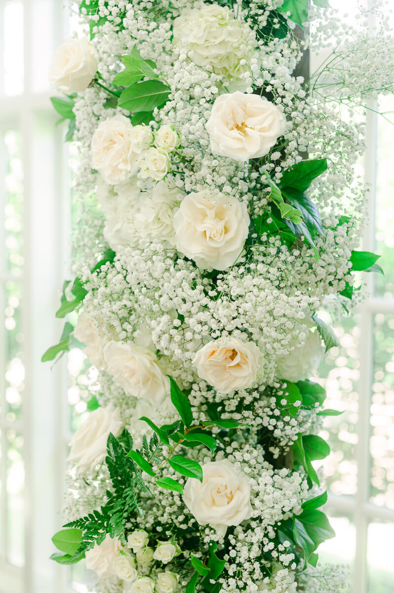 flower arch inside The Peach Orchard wedding chapel