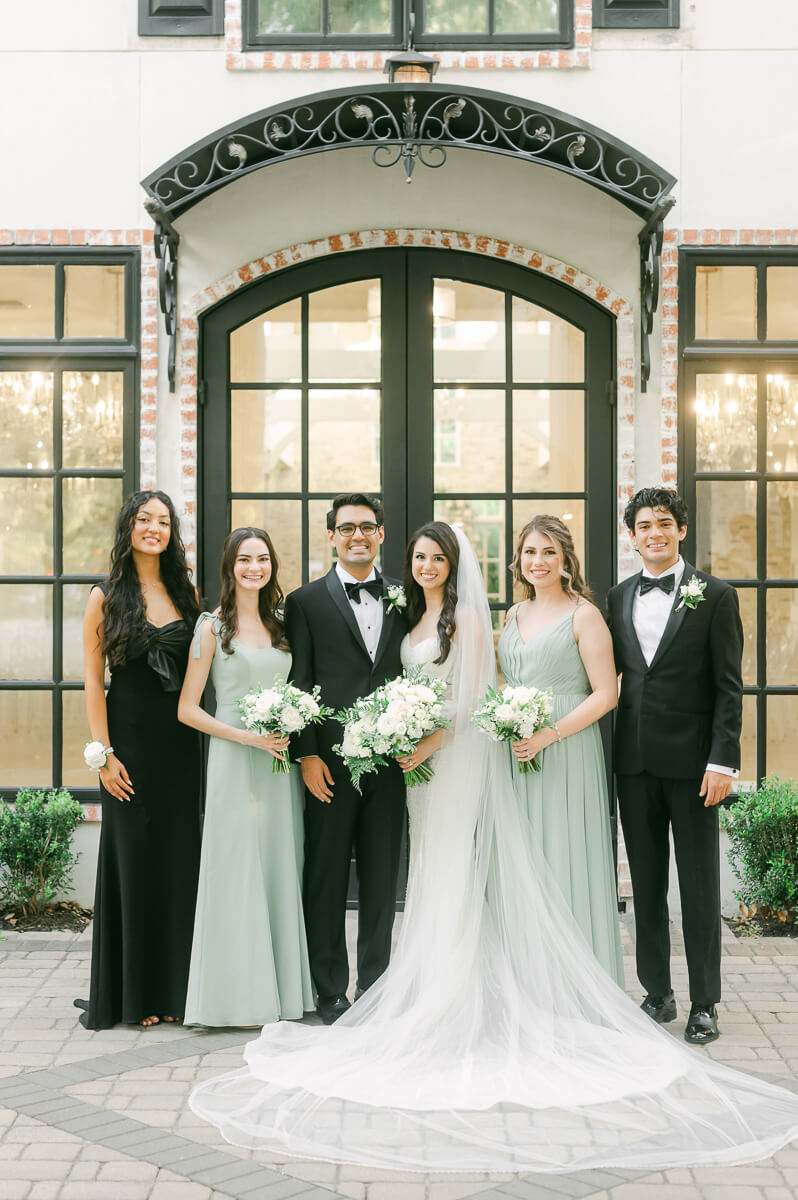 wedding party standing outside The Peach Orchard 