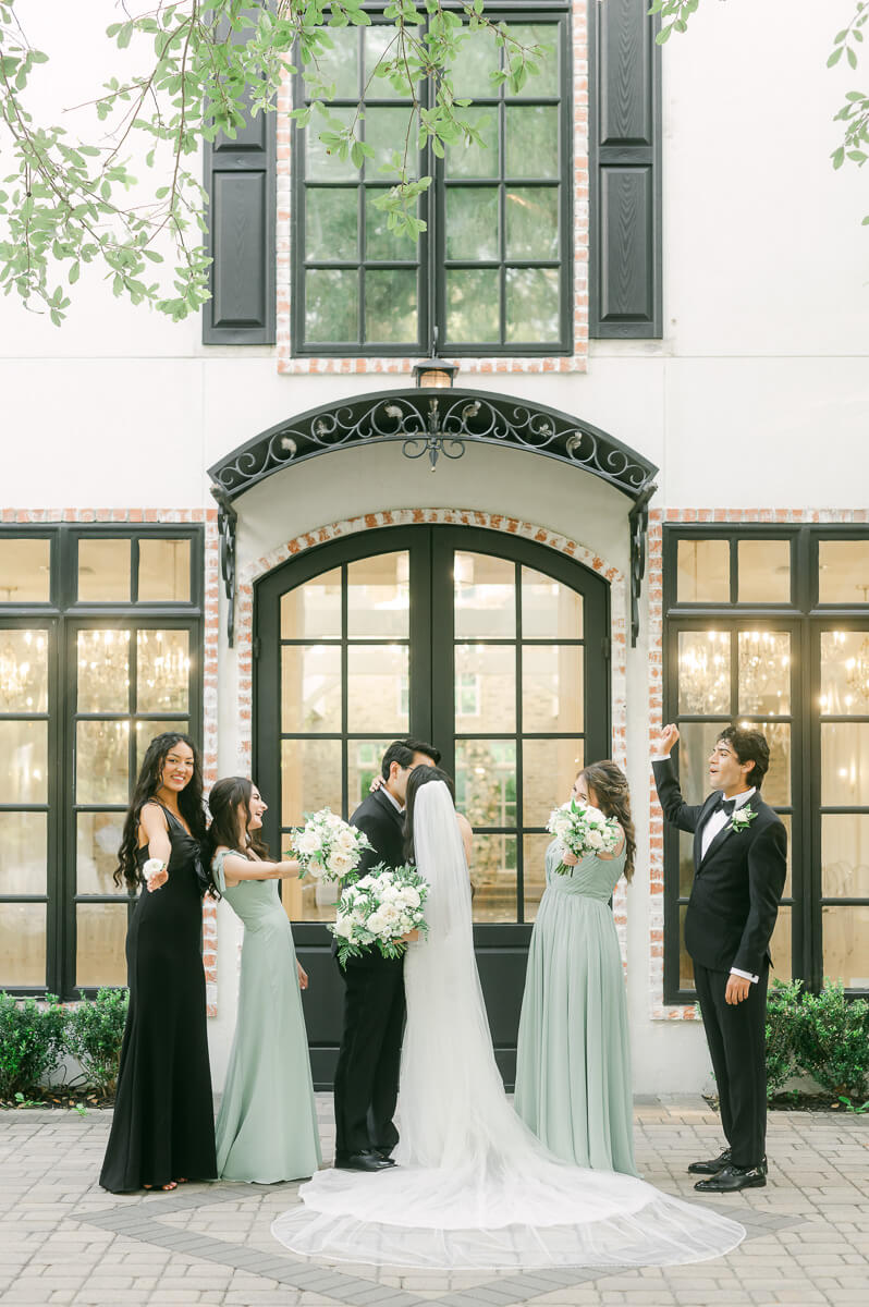 wedding party standing outside The Peach Orchard 