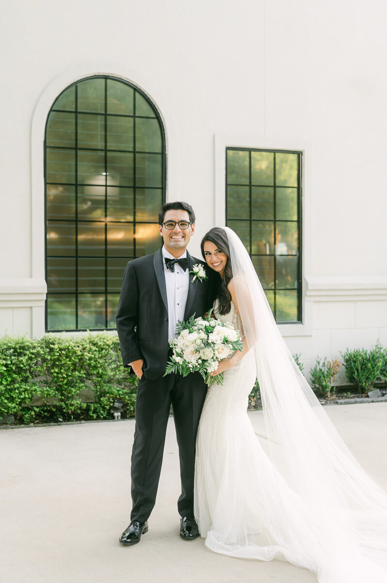 couple outside The Peach Orchard wedding venue