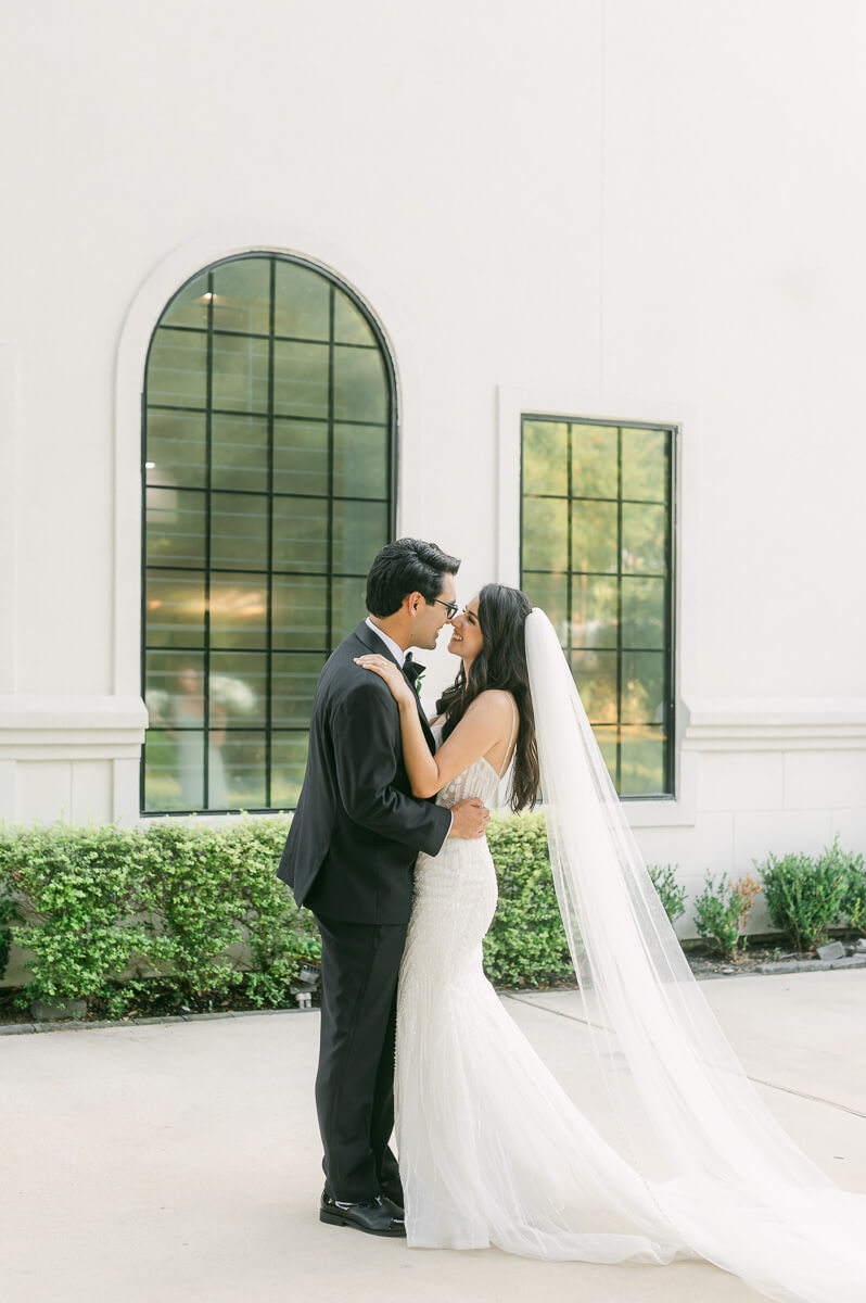 couple in front of The Peach Orchard wedding venue in Houston 