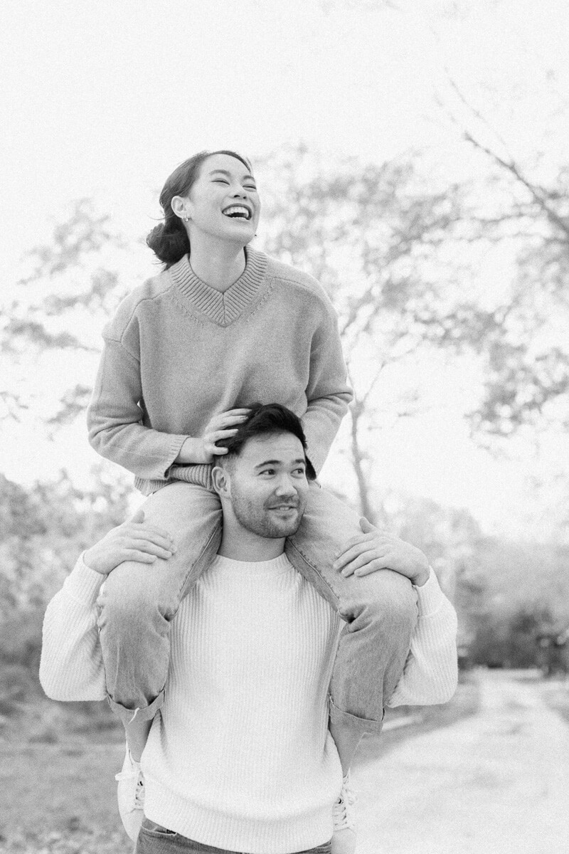 couple posing for photos with houston engagement photographer 