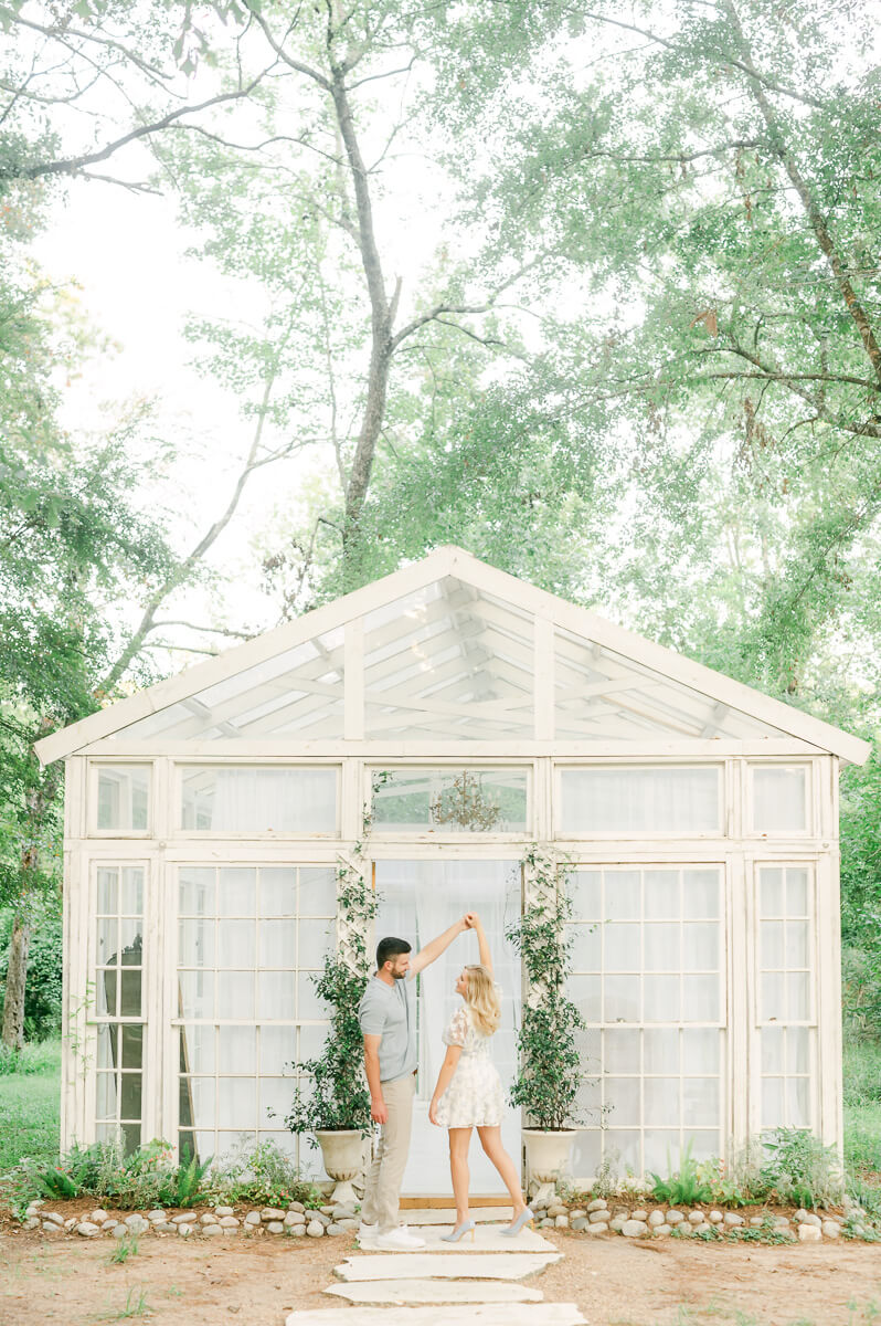 engaged couple in front of the oak atelier houston texas