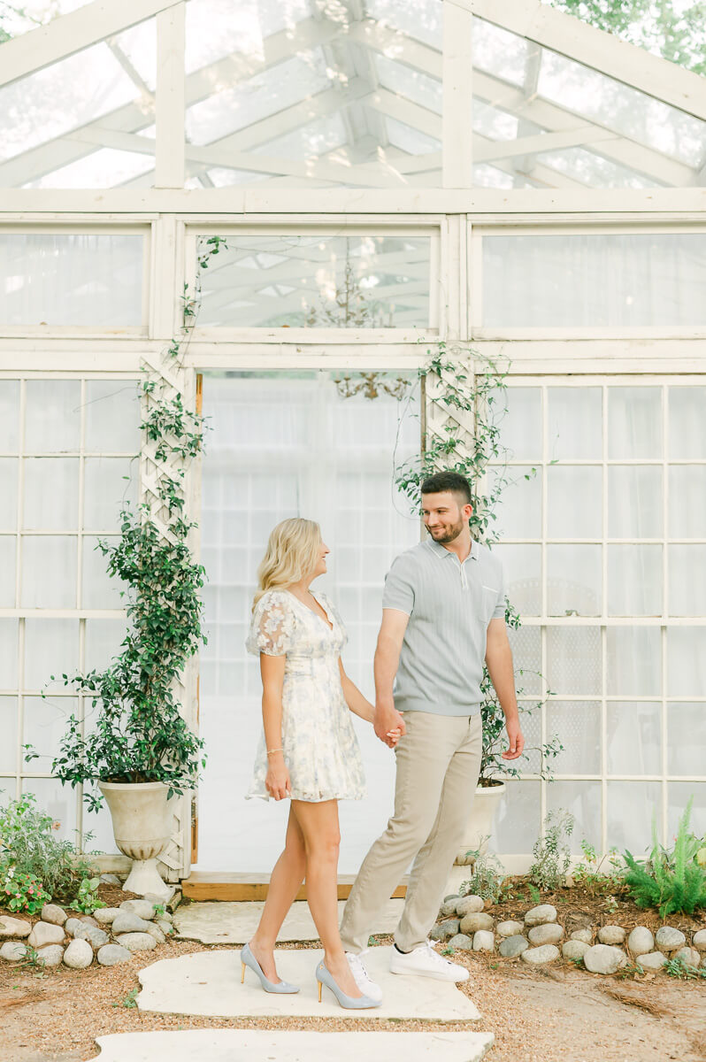 engaged couple in front of the oak atelier houston texas