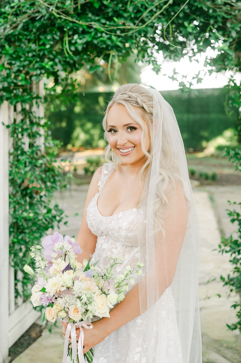 a bride at the peach orchard by houston wedding photographer Eric & Jenn Photography