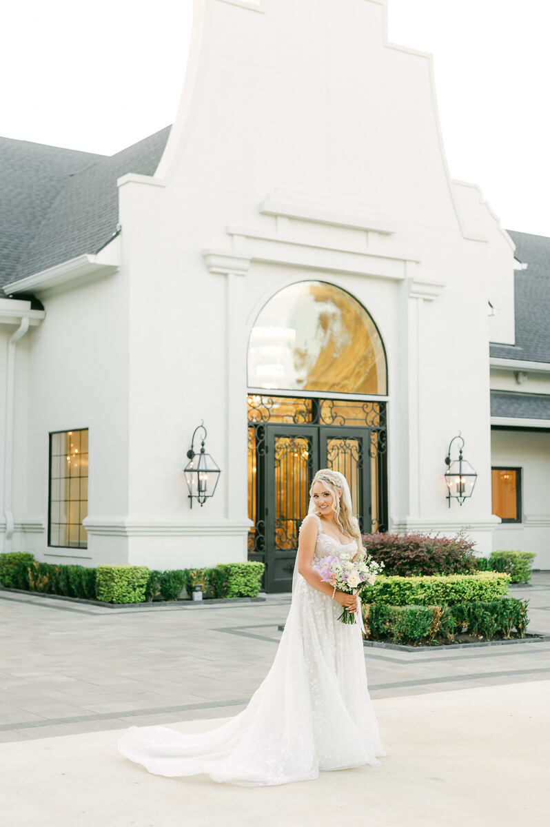 a bride outside the peach orchard wedding venue 