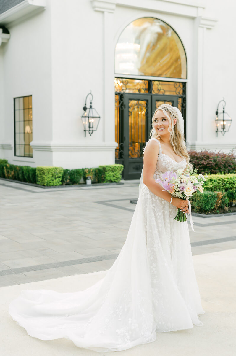 a bride outside the peach orchard wedding venue 