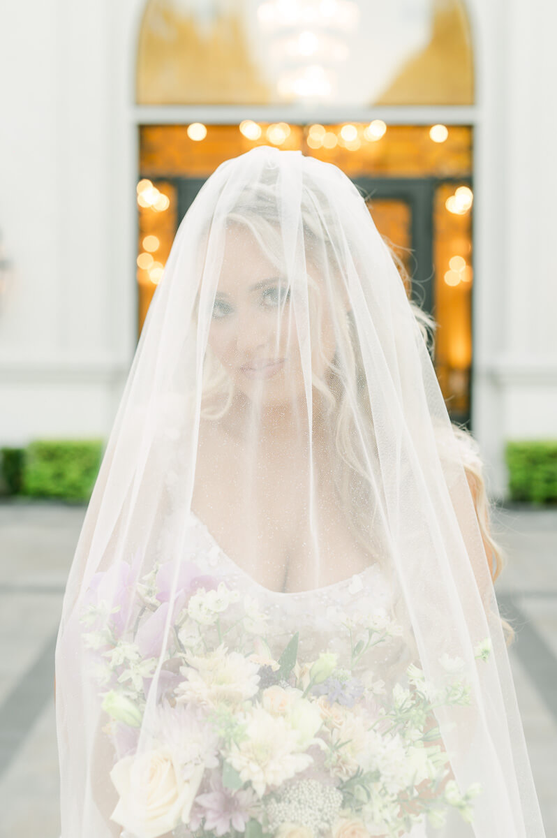 a bride outside the peach orchard wedding venue 