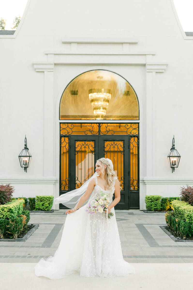 a bride outside the peach orchard wedding venue 