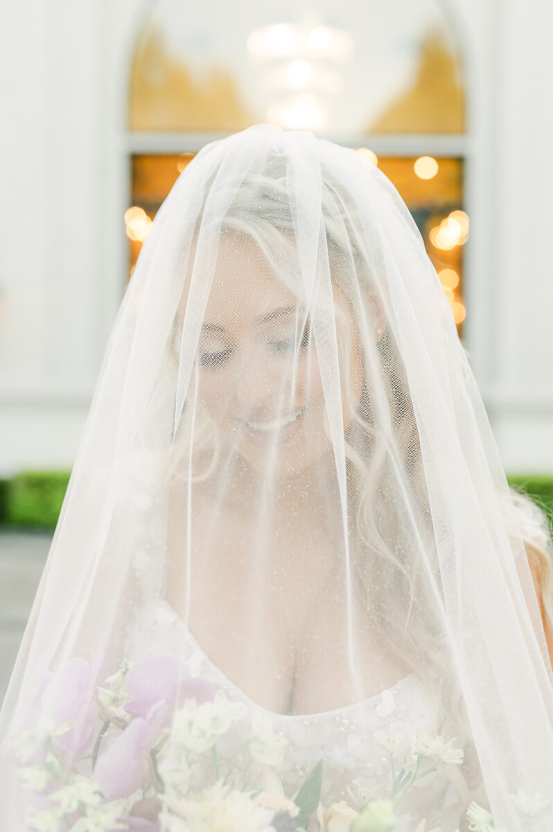 a bride wearing a veil by houston wedding photographer Eric & Jenn Photography 