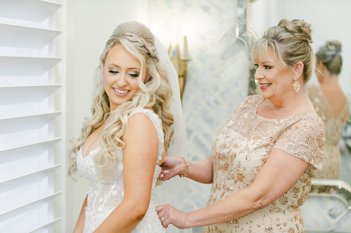 bride getting ready in the peach orchard bridal suite