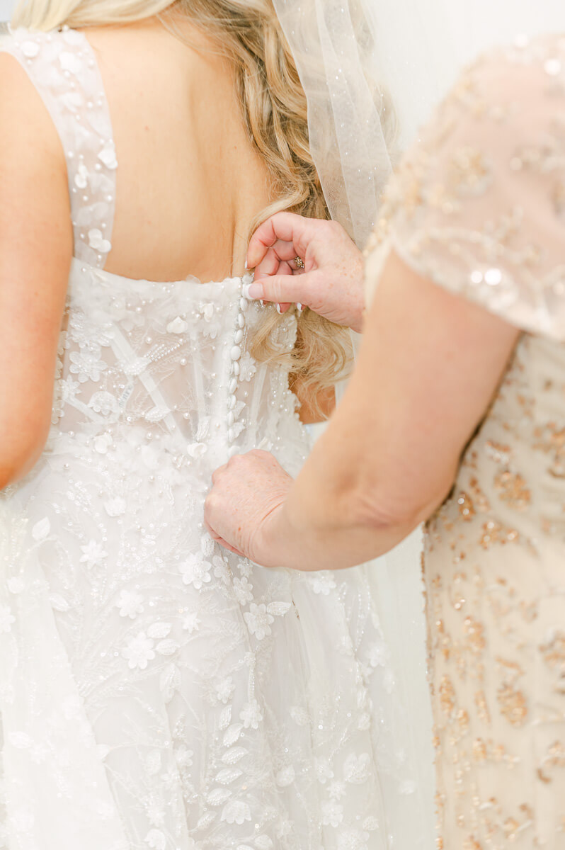 bride getting ready in the peach orchard bridal suite