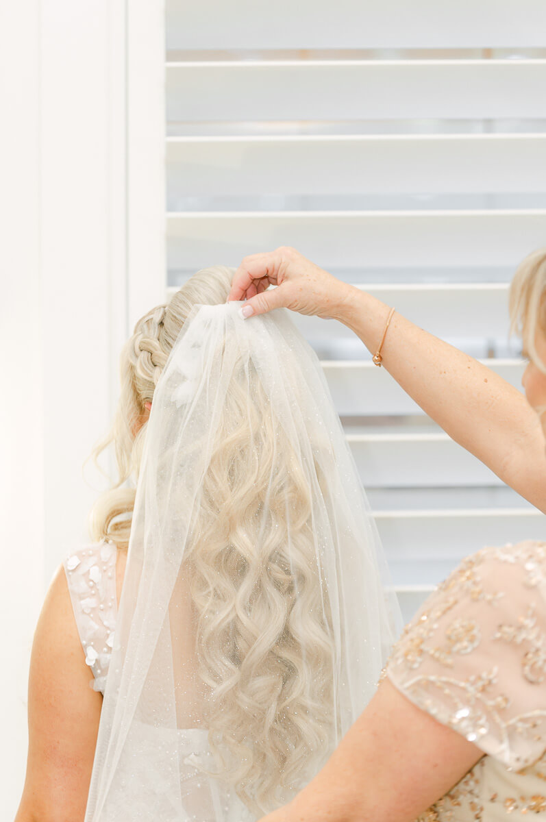 bride getting ready in the peach orchard bridal suite