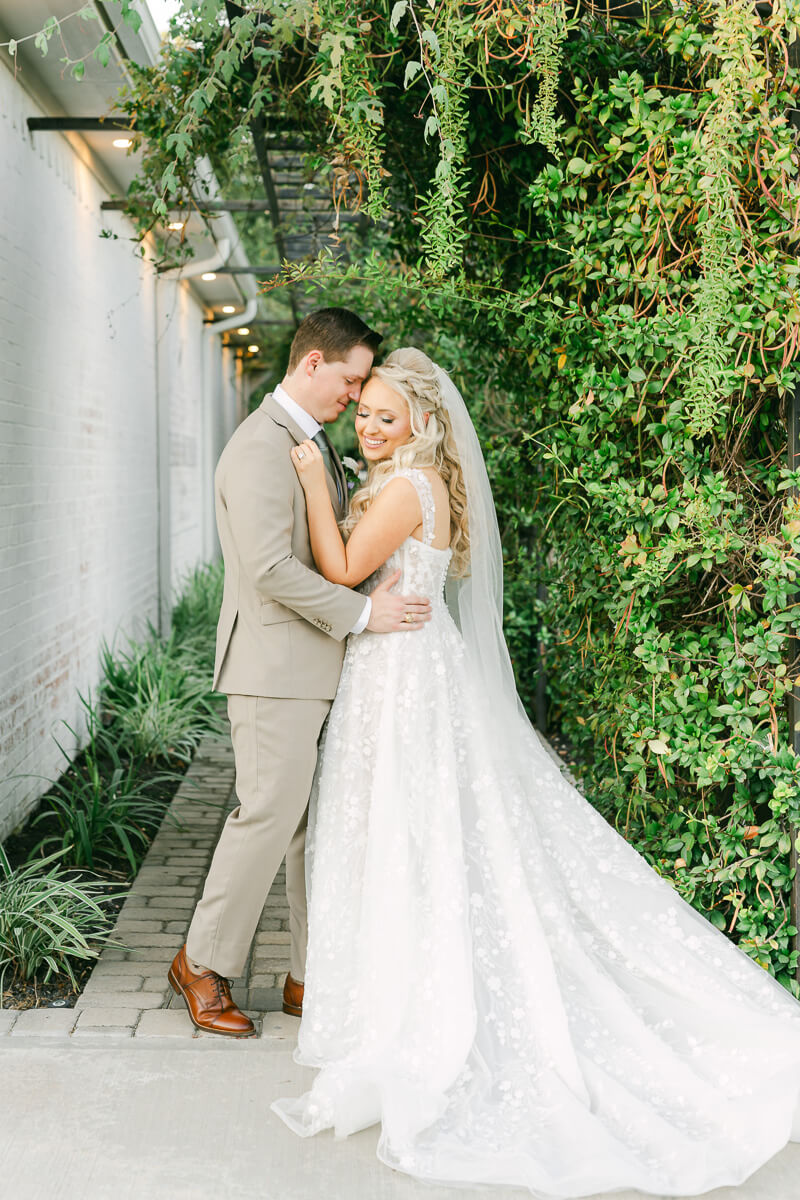 bride and groom on their wedding day by Houston wedding photographers Eric and Jenn Photography