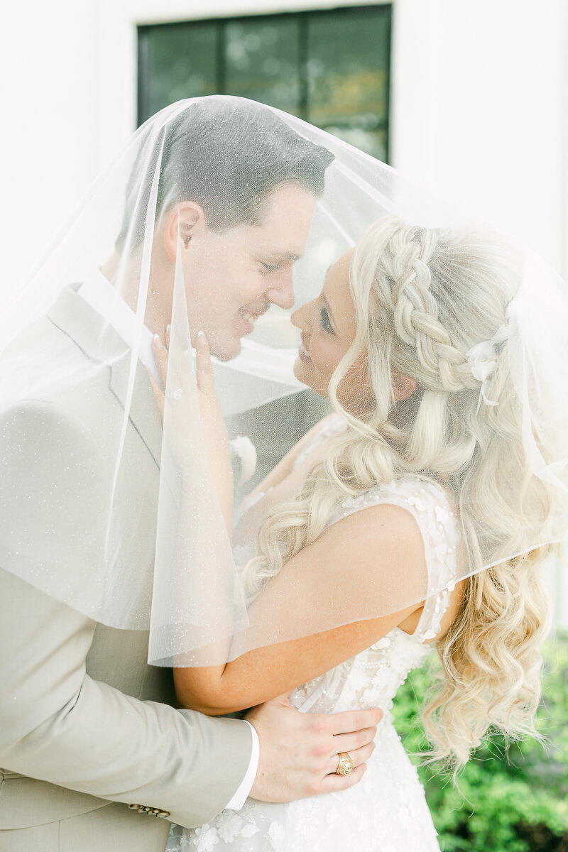 couple in front of the peach orchard wedding venue in houston