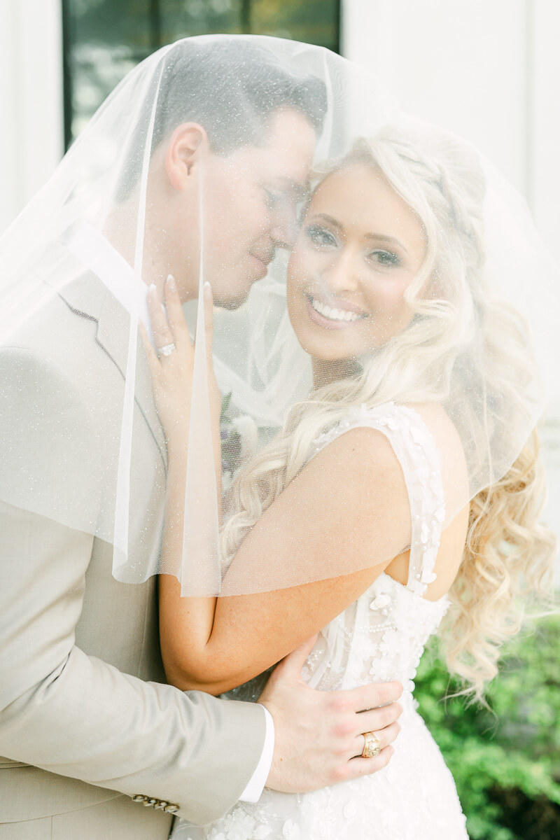 couple in front of the peach orchard wedding venue in houston