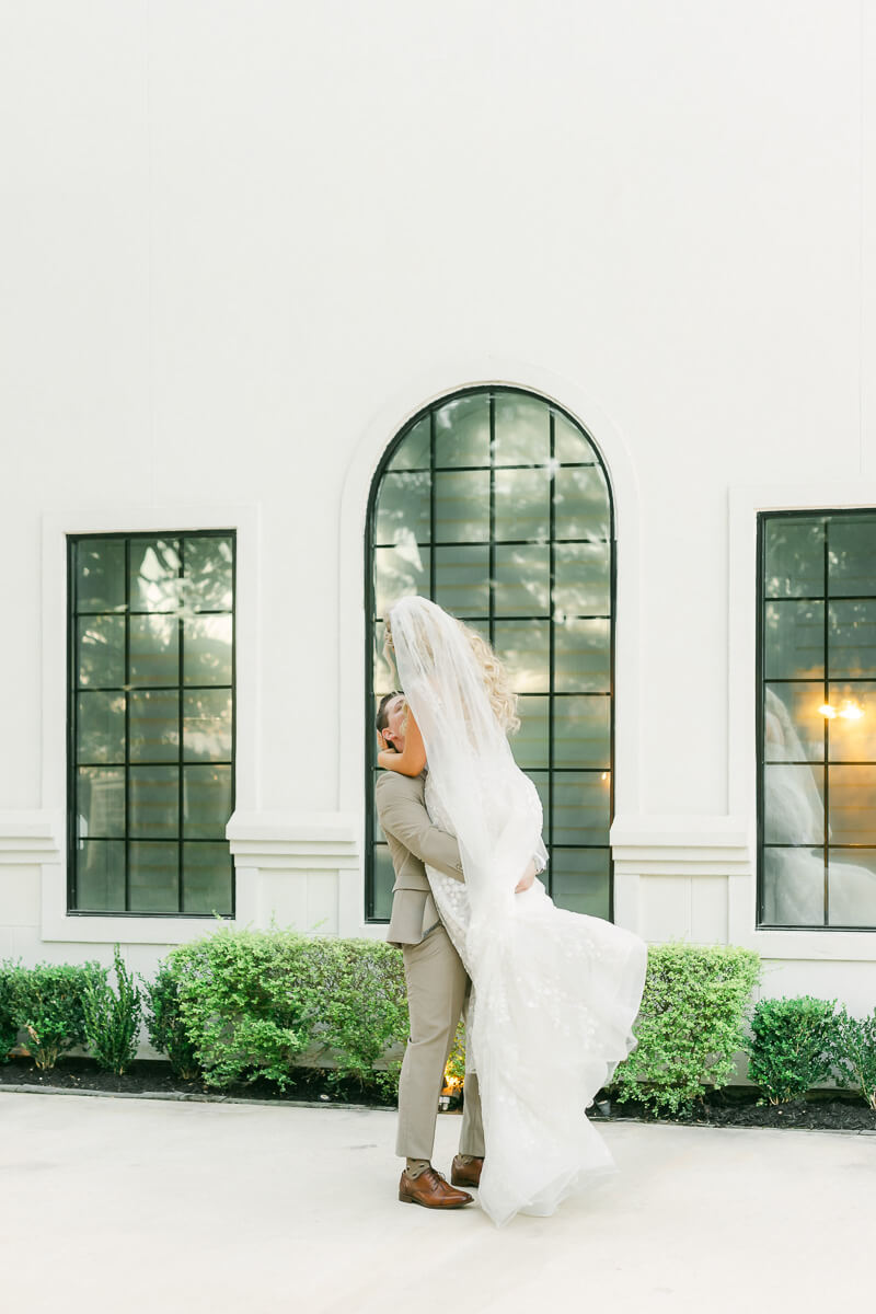 couple in front of the peach orchard wedding venue in houston