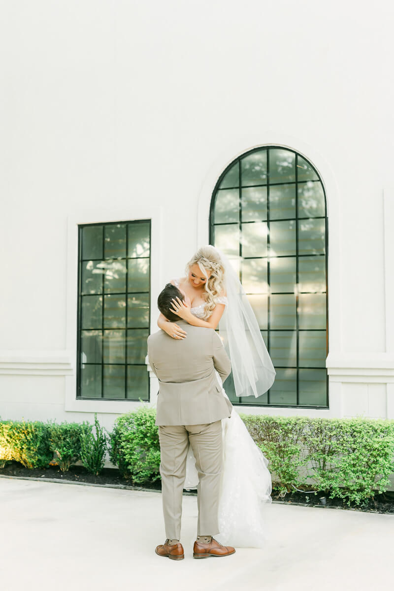 couple in front of the peach orchard wedding venue in houston