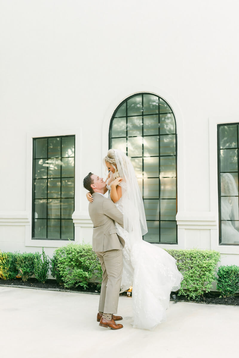 couple in front of the peach orchard wedding venue in houston