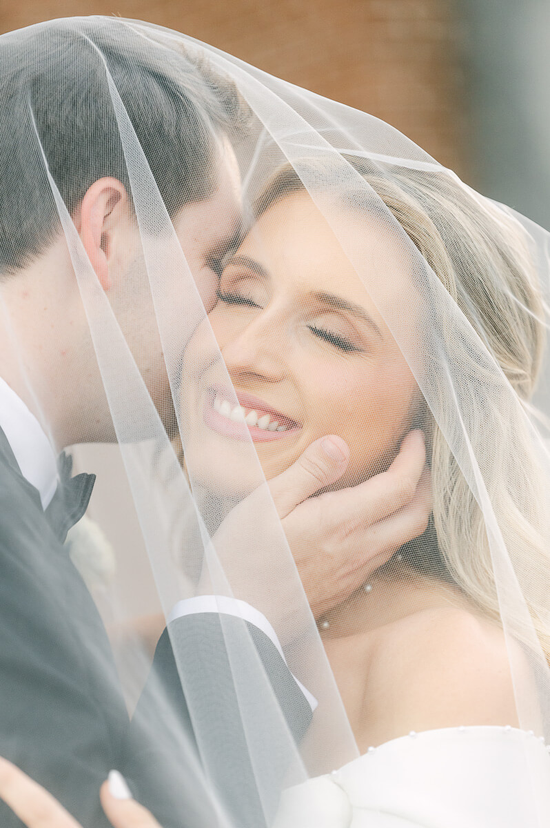 bride and groom posing for beaumont wedding photographer