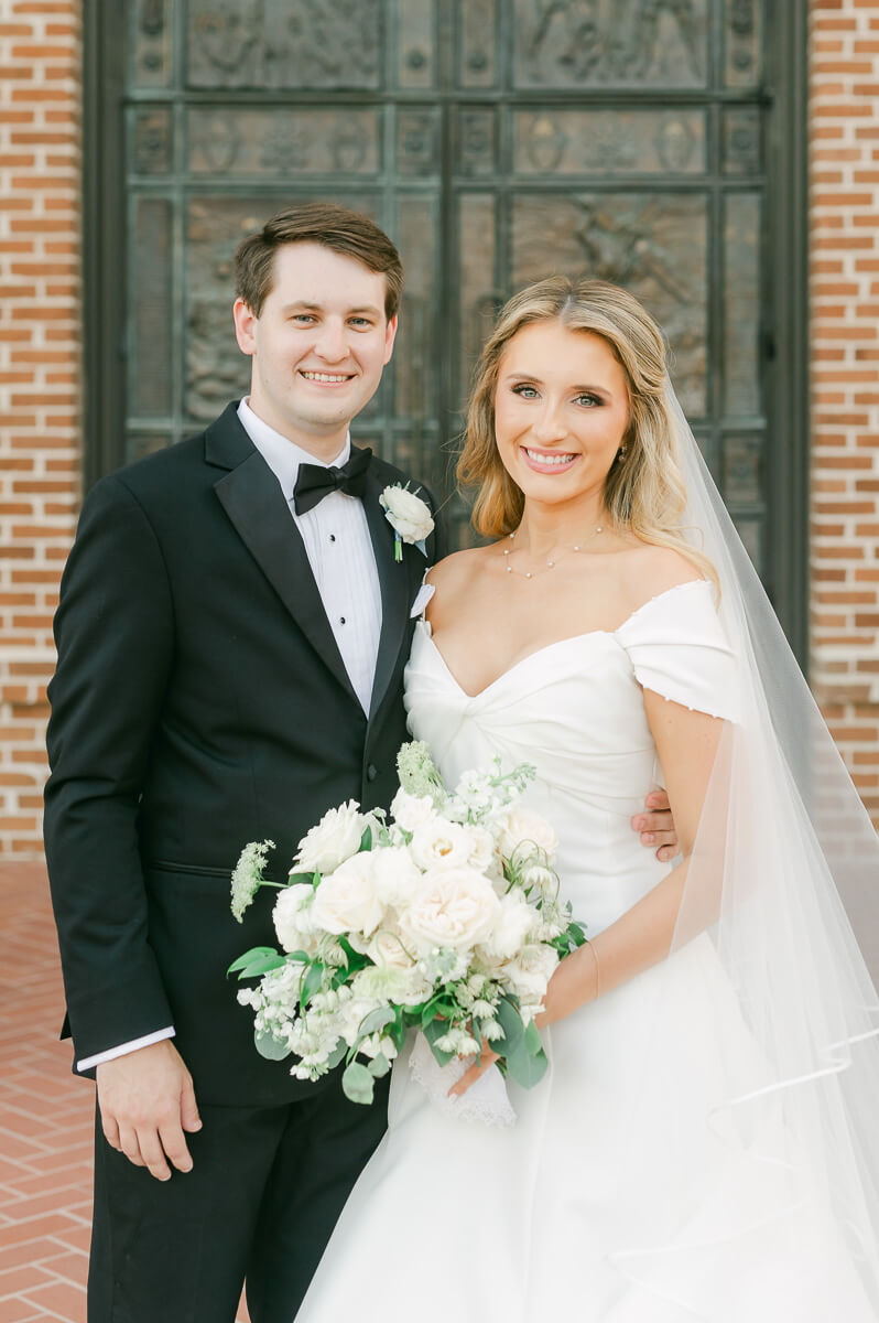 bride and groom posing for beaumont wedding photographer