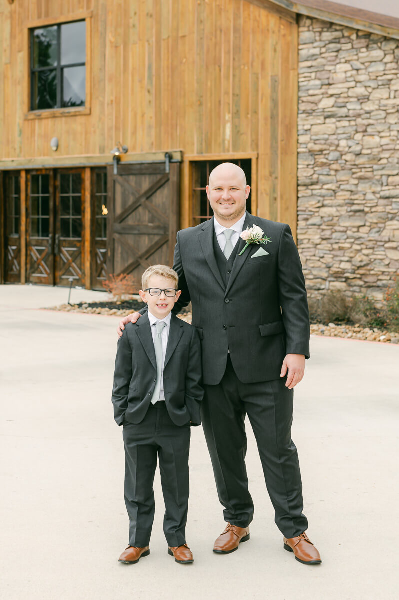 groomsmen in front of big sky barn