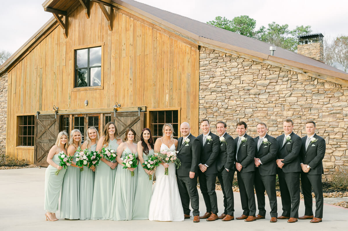 wedding party walking in front of wedding venue in Montgomery, Tx