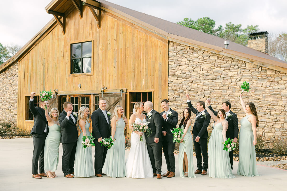 wedding party walking in front of wedding venue in Montgomery, Tx