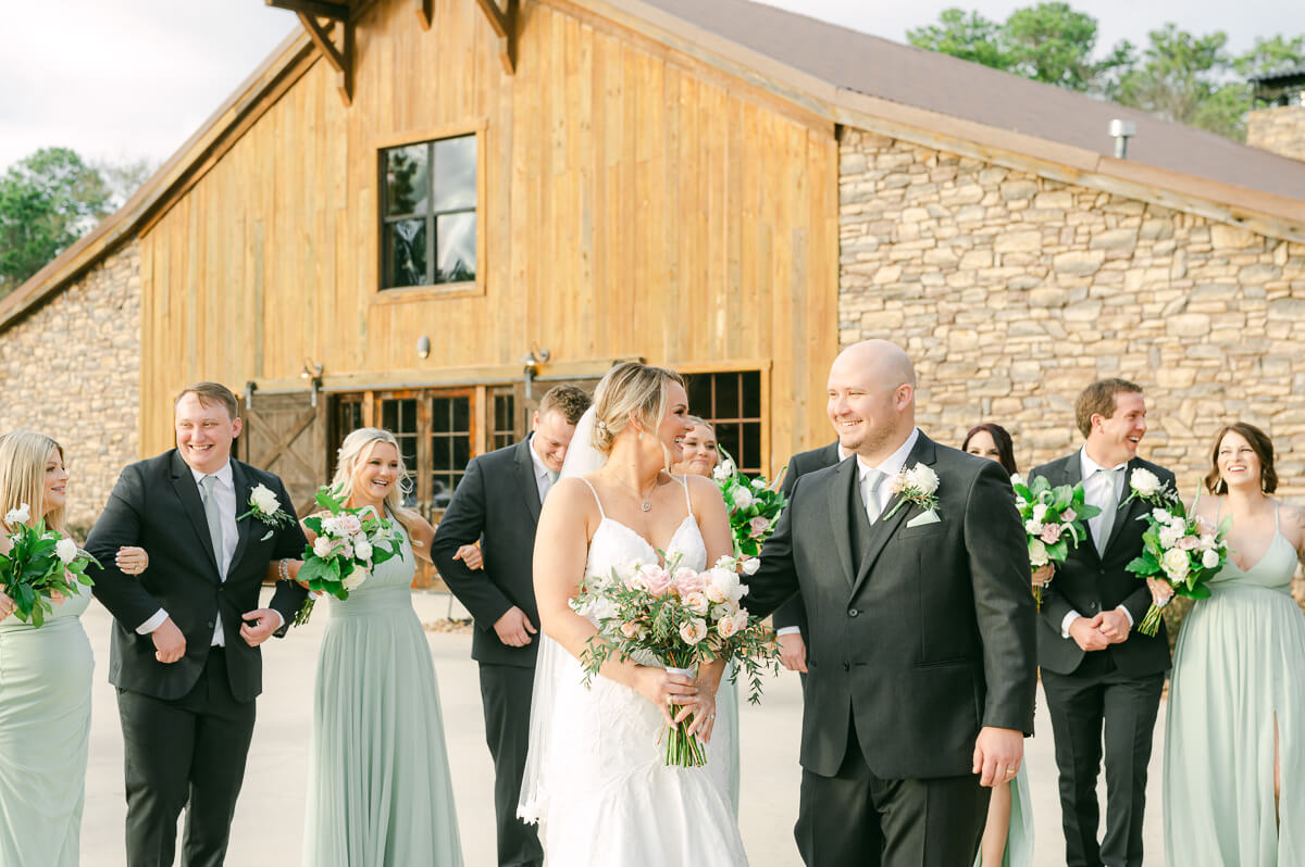 wedding party walking in front of wedding venue in Montgomery, Tx