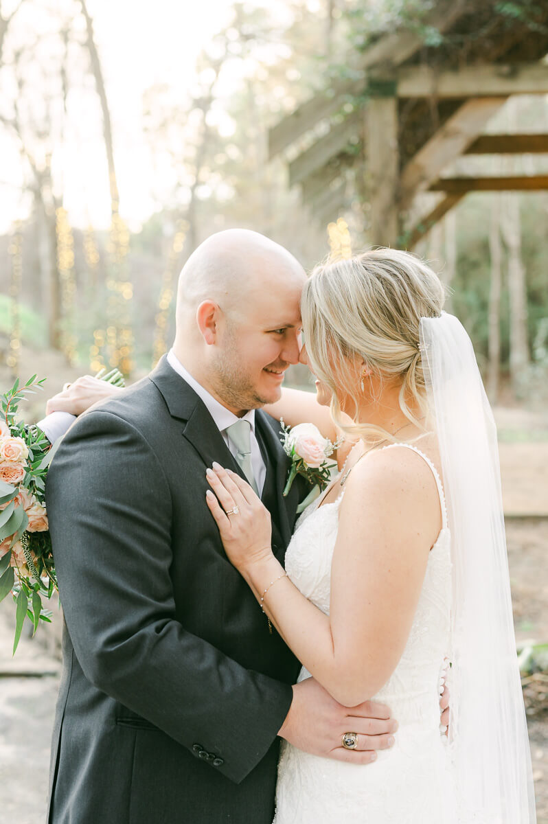 bride and groom posing for houston wedding photographer