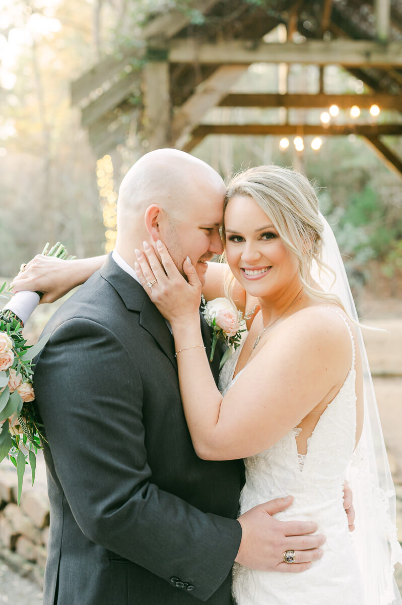 bride and groom posing for houston wedding photographer