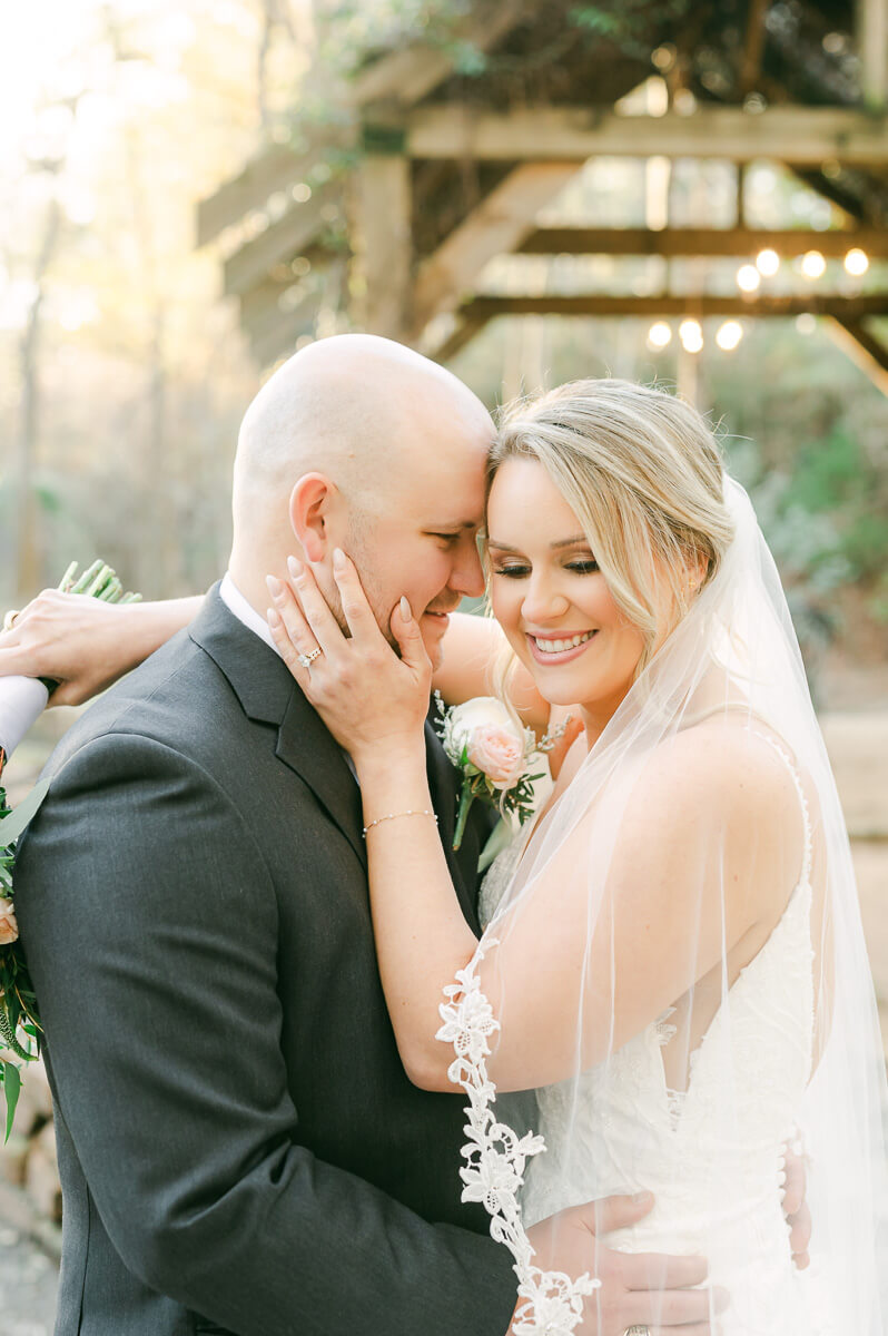 bride and groom posing for houston wedding photographer