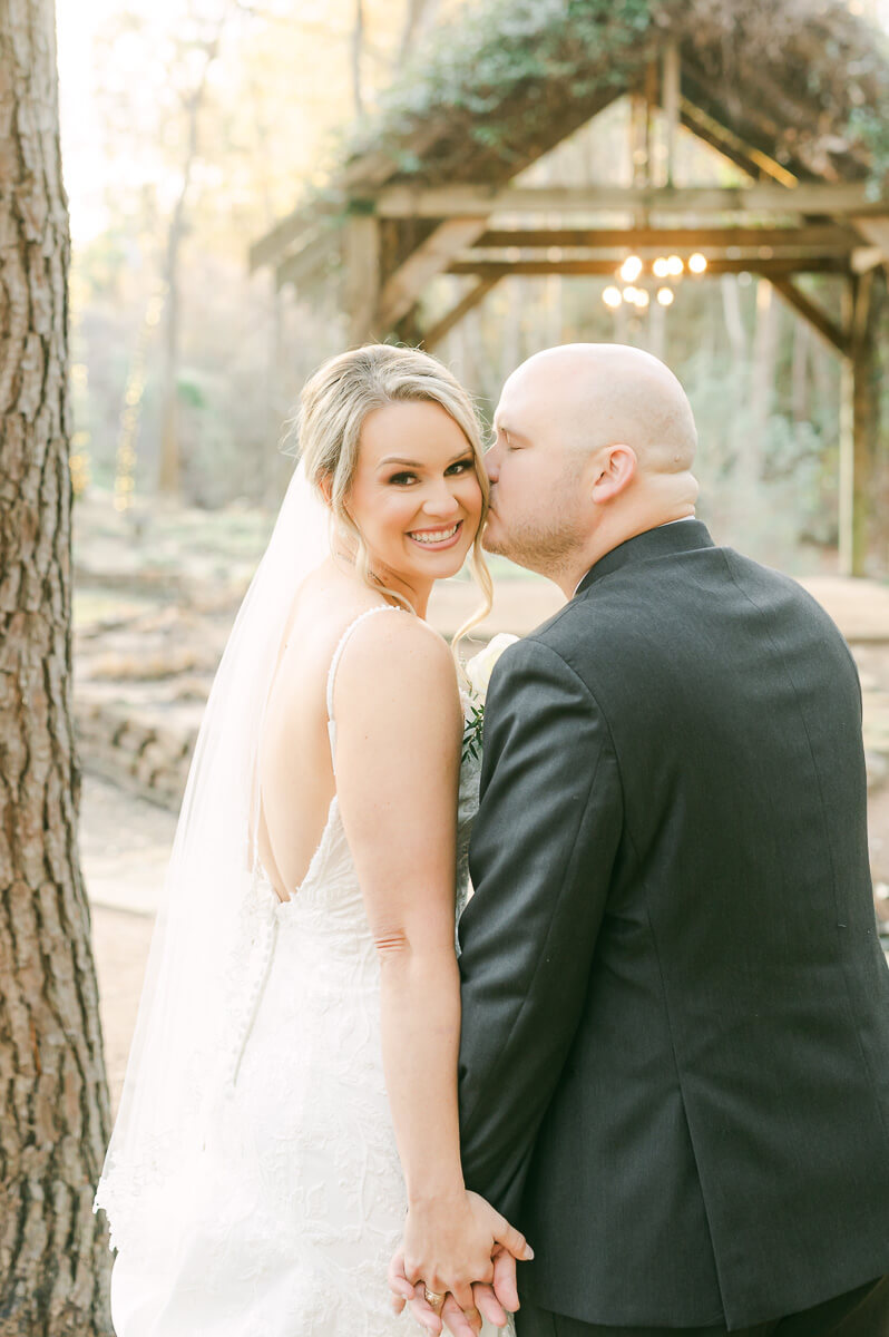 bride and groom posing for Montgomery, Tx wedding photographer