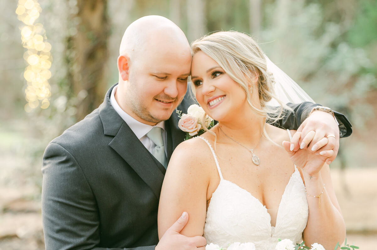 bride and groom posing for Montgomery, Tx wedding photographer