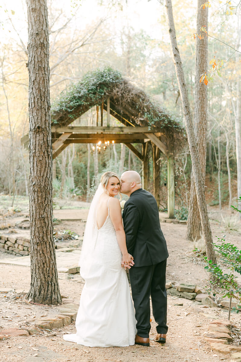 bride and groom posing for Montgomery, Tx wedding photographer