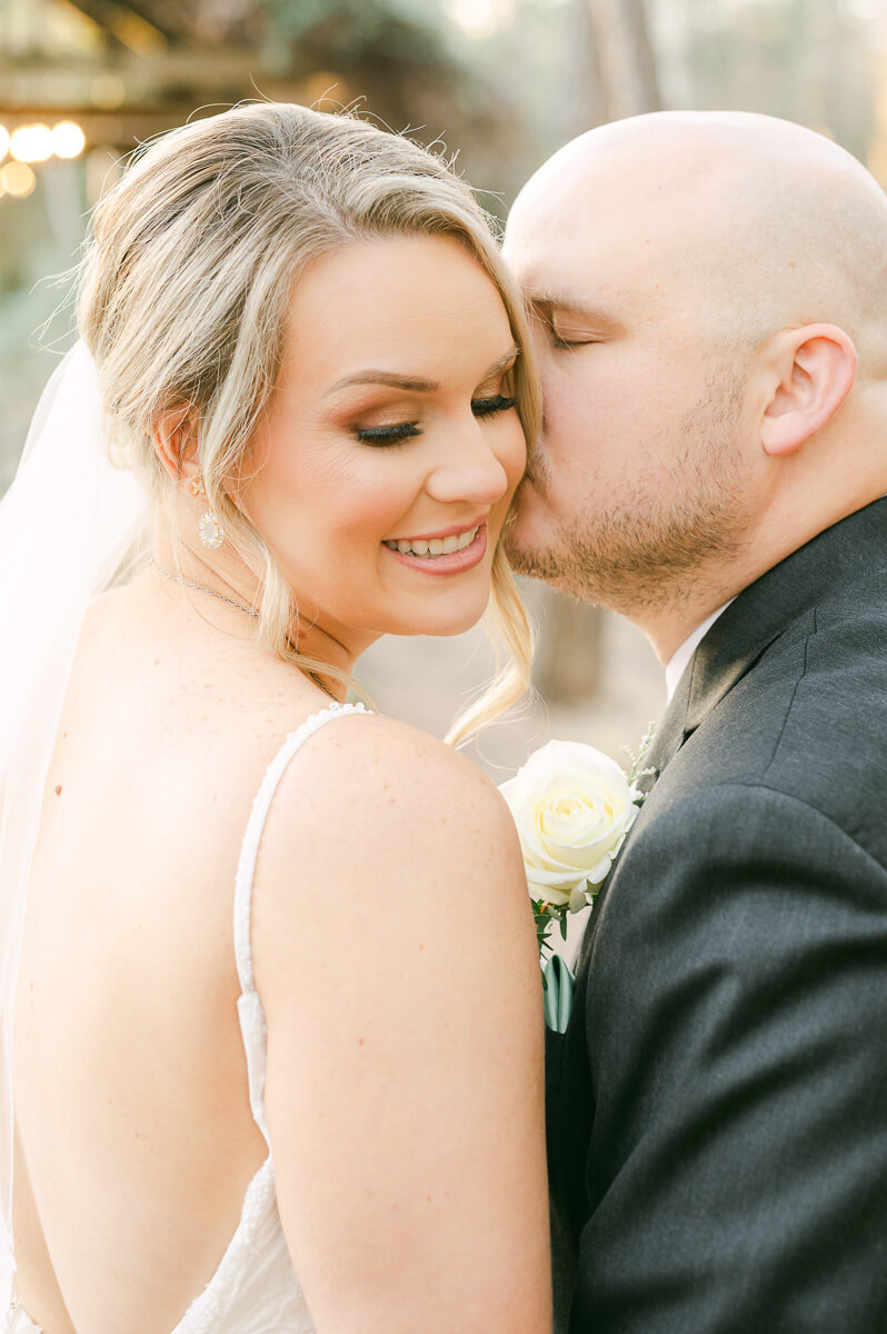 bride and groom posing for Montgomery, Tx wedding photographer