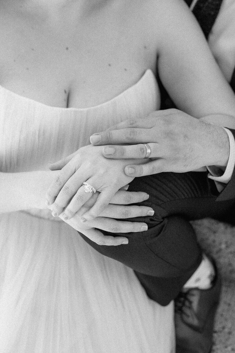 bride and groom posing on steps of downtown Houston historic courthouse